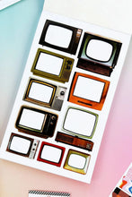 Load image into Gallery viewer, Sheet of retro television-shaped stickers on a colorful background