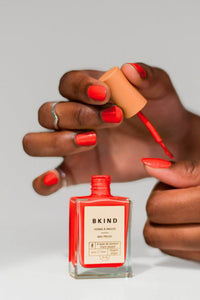 Bkind Nail Polish in bright orange red
