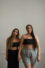 Load image into Gallery viewer, Two models wearing asymmetrical black bralette tops in Victoria BC